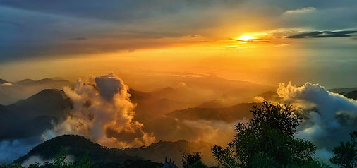 Sunlight above a mountain landscape and clouds